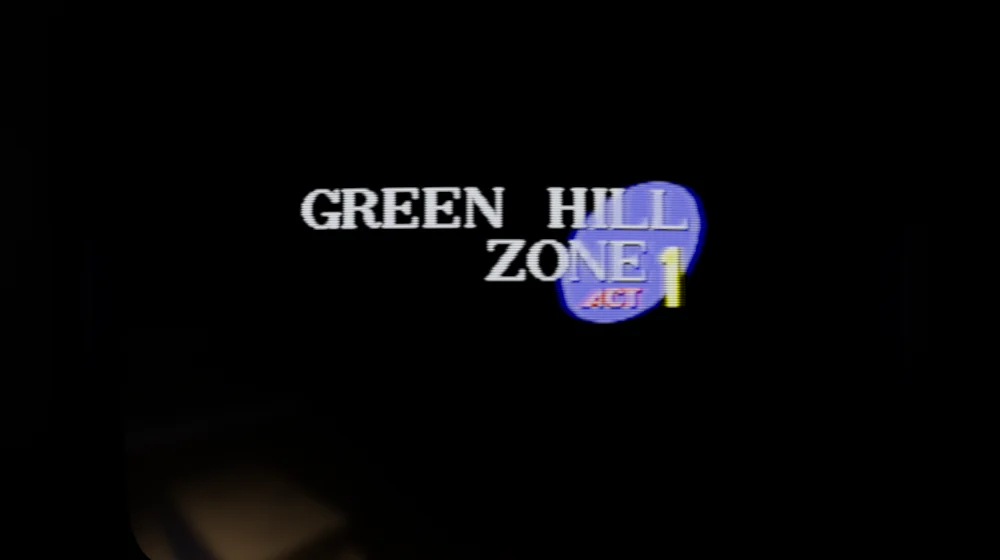 The TV close up, showing Sonic 1’s Green Hill Zone Act 1 title card